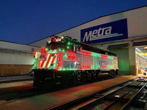 Metra City of Chicago locomotive decorated with holiday lights at the Western Avenue Yard